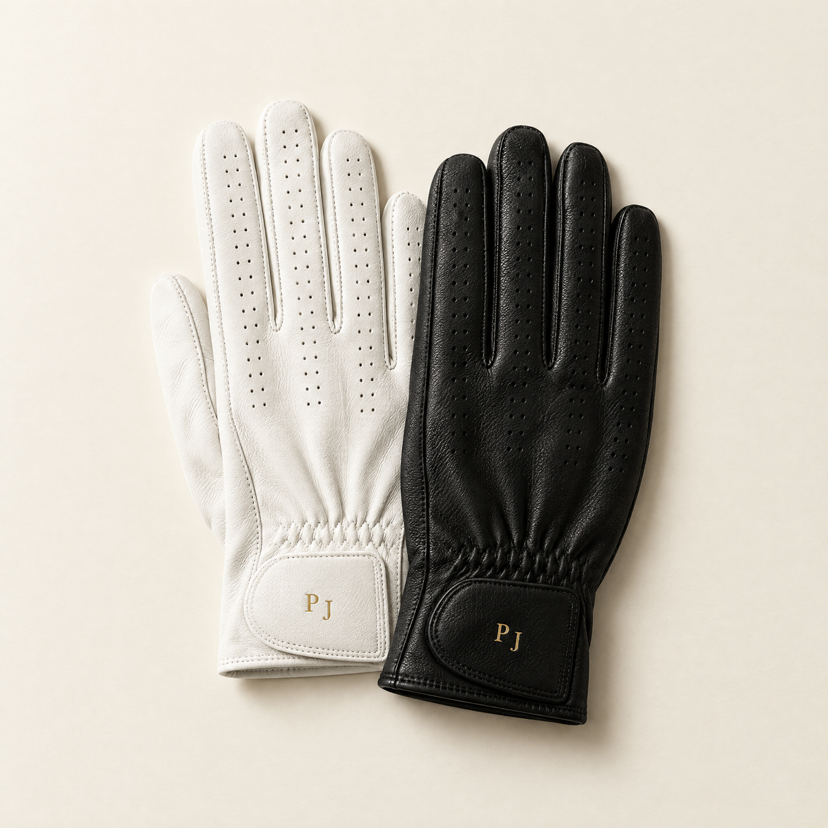 Two personalised gloves, white and black, side by side